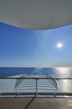 View from the ship's deck, Mein Schiff 6, of the vast sea under bright sunshine and blue skies,