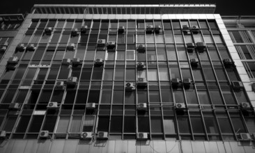 Air conditioners on house facade, black and white, Thessaloniki, Macedonia, Greece