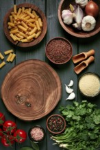 Food concept, wooden chopping board, on a wooden table, with ingredients, spices and herbs, top
