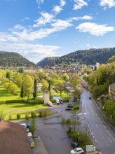 Idyllic town view with mountains, green meadows and blue sky, Bad Liebenzell, district of Calw,