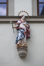 Figure of a saint on a town house, Bad Kissingen, Lower Franconia, Bavaria, Germany