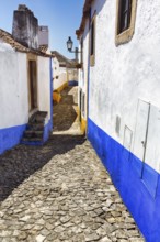 Typical alley in the medieval village of Óbidos, Portugal