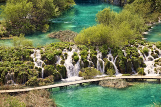 Cascades of water running over the travertine deposits between the lakes of Plitvice, Plitvice