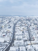 Small settlement under snow cover with straight main road, Deckenpfronn, Böblingen district,