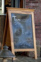 Daily meal on a table in front of an inn, Riegel am Kaiserstuhl, Baden-Württemberg, Germany