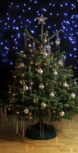 Christmas tree, decorated with tinsel and Christmas baubles, December, Advent, Germany
