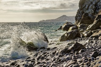 On the beach of Garajau, Ponta do Garajau stone beach, bathing beach, waves, surf, cliffs, Garajau,