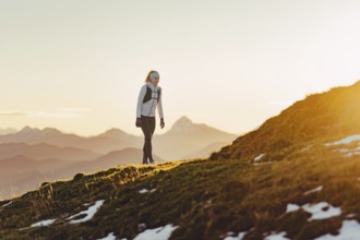 Trail running in autumn on the Jochberg on Lake Walchensee against the wonderful backdrop of the