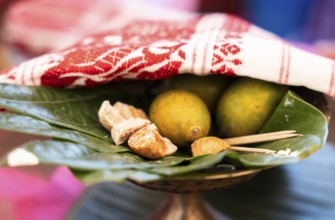 Assamese traditional food Tamul-paan (areca nut and betel leaves) at a stall during Magh Bihu or