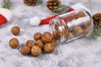Traditional German Christmas sweets called Marzipankartoffeln. Round ball shaped almond paste