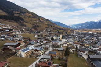 Drone shot, view of village with parish church, Piesendorf, Pinzgau, Salzburg province, Austria