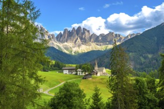 Scenic landscape showing st. Magdalena church in val di funes with the odle mountain range in the