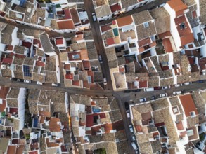 Streets and rooftops in the White Town of Olvera. Aerial view. Drone shot. Cádiz province,