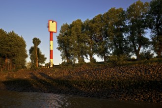 Lighthouse front light Bubendey-Ufer at the ferry terminal in atmospheric evening light,