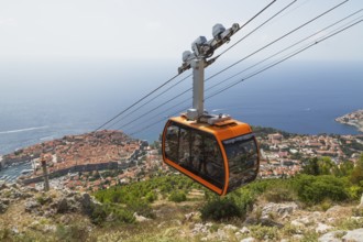 High angle view of cable car transporting tourists from Dubrovnik city center to top of Mount Srd