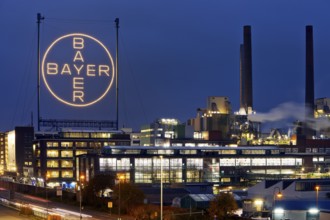 Bayer cross in the blue hour on the premises of Bayer AG, Leverkusen, Bergisches Land, North