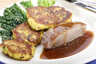 Swabian cuisine, medallions of wild boar with savoy cabbage cakes, meat dish, roasted, hearty, home