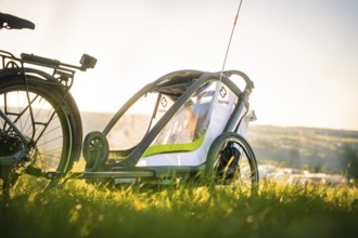 Side view of a bicycle trailer in a meadow with a wide view, e-bike, forest bike, Calw, district of