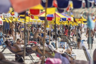 Overtourism in Thailand. Mass tourism on the sandy beach of Patong, the deckchairs are packed