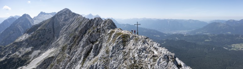 Aerial view, Alpine panorama, hikers at the summit cross, Westliche Wettersteinspitze, Wetterstein