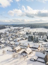 Snowy village view with houses and forest under a cloudy sky, Oberreichenbach, Black Forest, Calw