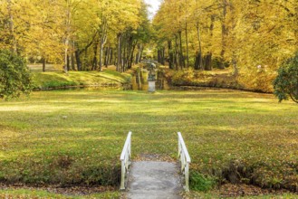 Castle park of Hermsdorf Castle with castle moat in autumn, Ottendorf-Ockrilla, Saxony, Germany