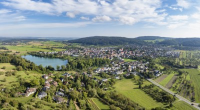 Aerial view of the municipality of Steißlingen with the natural bathing lake Steißlinger See,