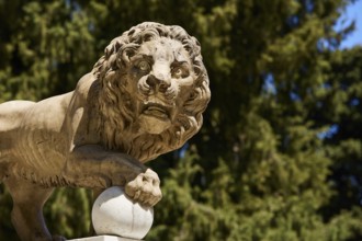 Detailed view of a lion statue with forest in the background, Rodini Park, City Park, Rhodes Town,