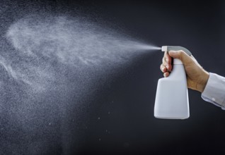 A man sprays a liquid into the air in Berlin, 09/08/2024