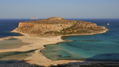 Tigani Island, Pontikos Island, morning light, lagoon, sandbank, parasols, tourists on the beach,