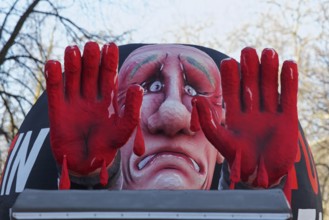 Putin as a convict with blood on his hands, Put In Jail, papier-mâché figure, theme float by