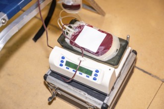 Top view of a scale weighing the bag of blood extracted from a donor with no people around