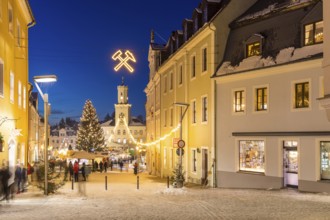 Christmas market with town hall and Christmas tree at the blue hour in Schneeberg, Erzgebirge,