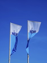 Two flags with lettering NDR, Norddeutscher Rundfunk, Landesfunkhaus Schlossplatz 3, flagpoles,