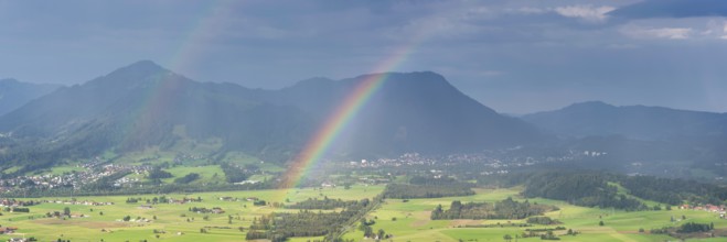 Panorama from the Grünten over the Illertal with rainbow to Blaichach and Immenstadt, behind