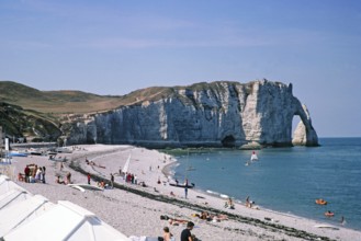 Chalk cliffs and sandy beach view to Falaise d'Aval, Etretat beach, Normandy, France 1976