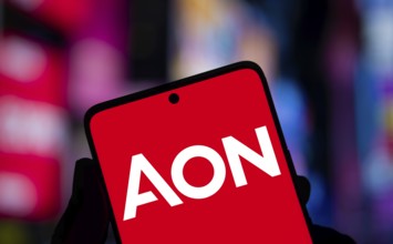Aon logo is displayed on smartphone. Aon plc is a British-American professional services.