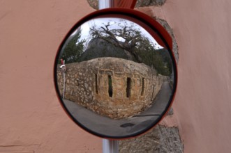 Reflection of a wall in a wide-angle mirror, traffic mirror 180 degrees, Alaró, Calvià, Majorca,