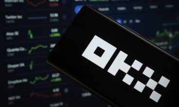 Dhaka, Bangladesh- 17 March 2025: okx logo is displayed on a smartphone screen, with a stock graph