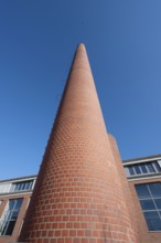 Former factory chimney in a new housing estate, Spardorf, Middle Franconia, Bavaria, Germany