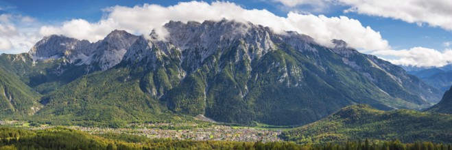 Panorama from Hoher Kranzberg, 1397m on Mittenwald, behind it the cloudy Karwendel Mountains,