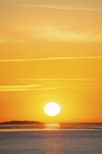 Picturesque, golden, magnificently beautiful sunset over the sea, Langlütjen II island far away,