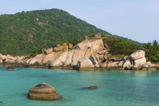 Bathing bay with turquoise water and granite rocks on the holiday island Nang Yuan Island, island,