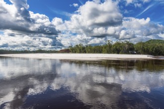 White sand beach before the granite hills of Cerros de Mavecure, Eastern Colombia