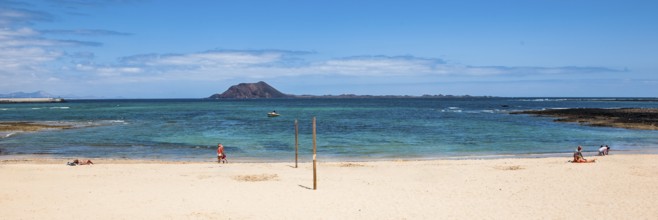 Panoramic photo of Corralejo beach in the background uninhabited island Islote de Lobos in the East