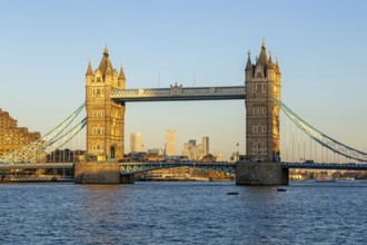 Tower Bridge in sunshine at dusk, River Thames from Southwark, London, England, UK