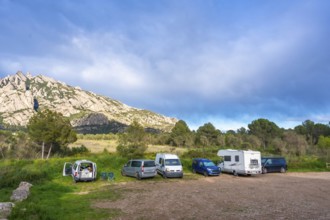 Camper vans enjoying the breathtaking view of the montserrat massif in catalonia, a popular