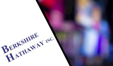 Berkshire Hathaway inc logo is displayed on smartphone. Berkshire Hathaway Inc is an American