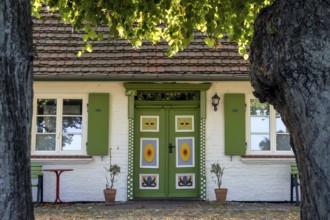 Colourful decorated front door in Bliesenrade at Wieck am Darß, holiday resort on the Darß