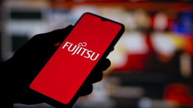 Fujitsu logo is displayed on smartphone. Fujitsu limited is a Japanese multinational tech company.
